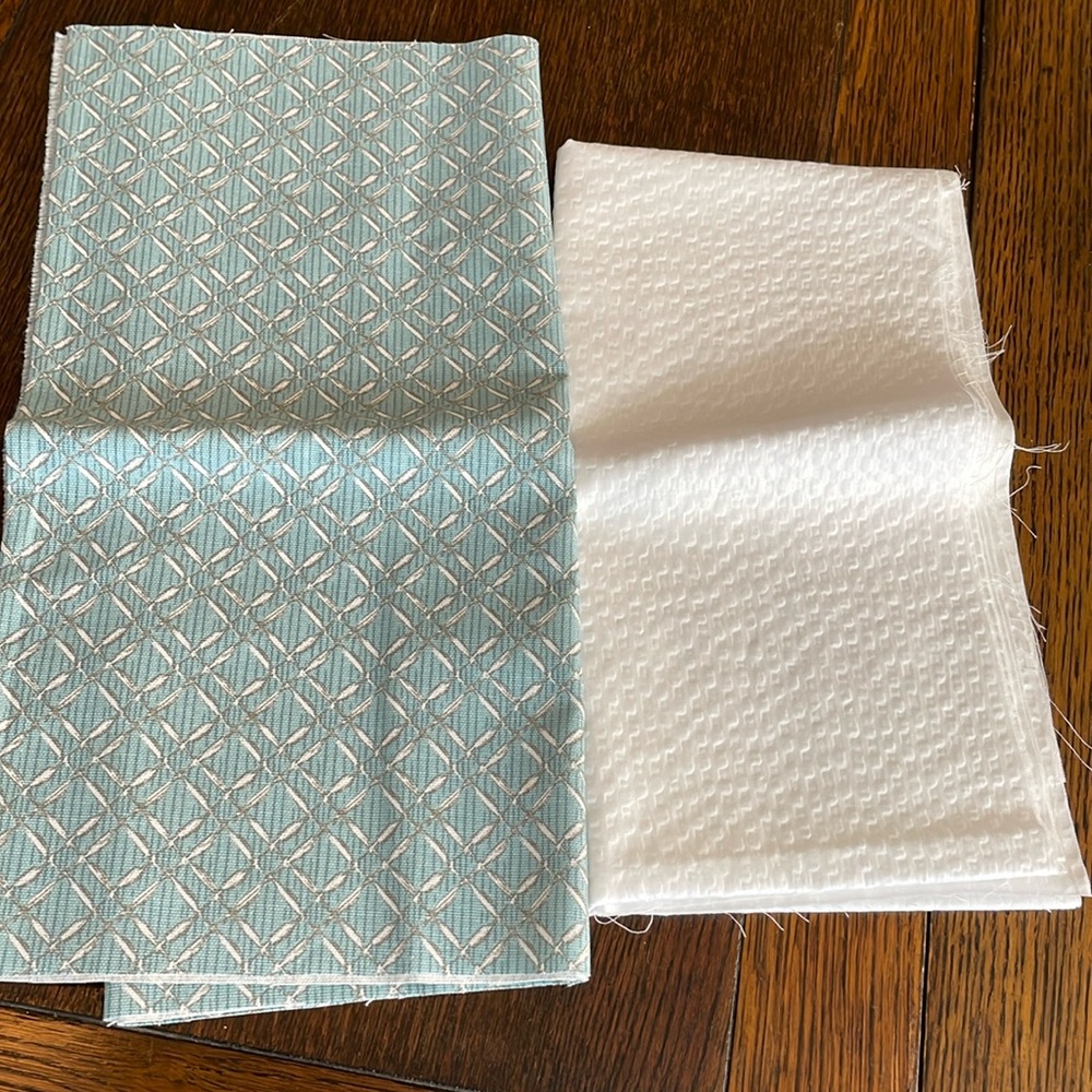 Fabric remnants (2 pieces) light blue/white geometric motif, white textured